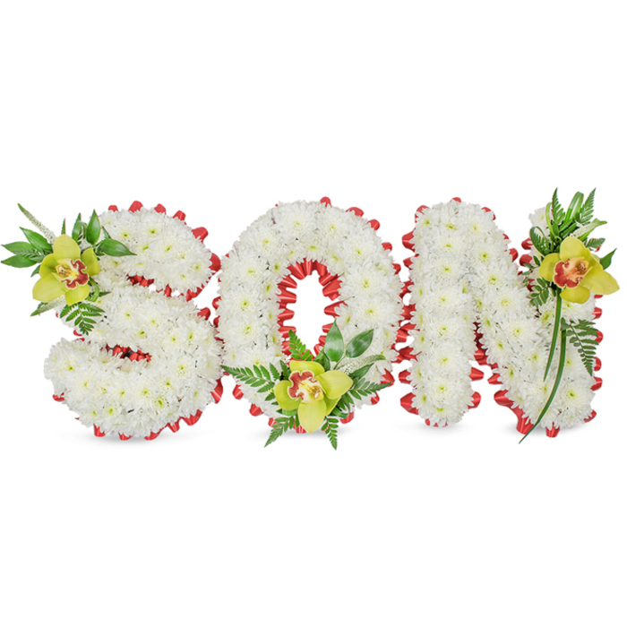 A sculptural sympathy piece reads plainly yet powerfully: SON, formed from thousands of small white chrysanthemum blooms pressed close together to create full, rounded letters with a soft, pillow-like texture. Each letter's edge is outlined with a continuous band of vibrant red ribbon, neatly looped into scallops that give a refined, almost lace-like border against the snowy flower faces. Three lime-green Cymbidium orchids punctuate the design, placed with intentional rhythm-the S's upper curve hosts one orchid, the circular O cradles another at its lower interior, and the N's upper stroke is softened by a third. Each orchid shows a subtle pale orange to reddish-brown marking in its throat and a satiny, waxy surface that provides a contrasting sheen beside the matte chrysanthemum petals. A carefully chosen palette of glossy green leaves and fragile fern fronds weave around and between the letters, lending natural lines that lift the arrangement and suggest renewal amid grief. The composition rests on a plain white background under gentle, even illumination so that texture, shadow and colour remain the focus. This personalized tribute is designed to be placed at a funeral, graveside or memorial service, speaking of devoted remembrance and familial love. For neighbours in Elmers End and nearby Croydon roads, this design is a considered way to honour a son, reflecting experienced floral workmanship and a quiet respect for ritual and memory.