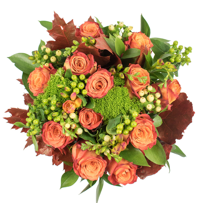 A densely gathered, circular bouquet photographed from above on a stark white backdrop, this arrangement celebrates autumn with a palette of coral-peach, orange, deep russet and multiple greens. The composition is centred on fully opened roses whose petals graduate from warm peach cores to coral and then to a subtle reddish-rust on outer edges-each bloom a small landscape of colour. Interspersed throughout are vibrant Green Trick dianthus tufts, their velvety, spherical texture like bright green moss that contrasts and lifts the roses. Glossy Hypericum berries appear in tight clusters: some in a zesty lime-green that feels fresh and modern, others in a soft creamy-yellow that adds quiet elegance. Fresh deep-green leaves form the foundational layer while larger, lobed leaves in dark burgundy and burnt orange punctuate the silhouette and reinforce the seasonal theme, recalling a stroll through Elmers End's tree-lined streets in late September. The bouquet's tactile diversity-from velvety petals to firm berries and feathery green clumps-creates depth and invites touch. Under soft studio light, highlights and gentle shadows model the forms and make the colours sing together. Crafted by Elmers End Florist, this arrangement is designed as a warm, sophisticated centrepiece for Thanksgiving dinner, a comforting gift to mark a birthday, or a decorative accent to bring autumn's warmth into a home on Kelsey Park Road or delivered across the local neighbourhood. It feels both abundant and refined, a celebration of harvest tones and florist craftsmanship.